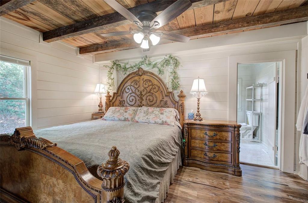 1252 Paris Mountain Road Rockmart, GA 30153 - Photo 29 of 93 a bed sitting in a bedroom next to a window