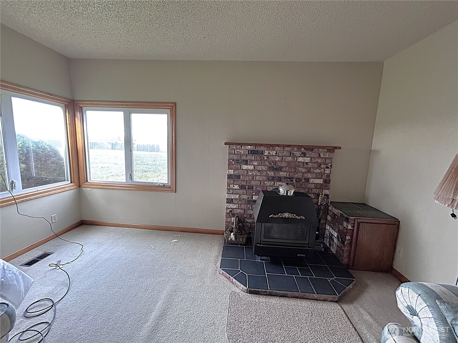 1925 Hampton Road Everson, WA 98247 - Photo 12 of 40 a living room with furniture a window and a fireplace