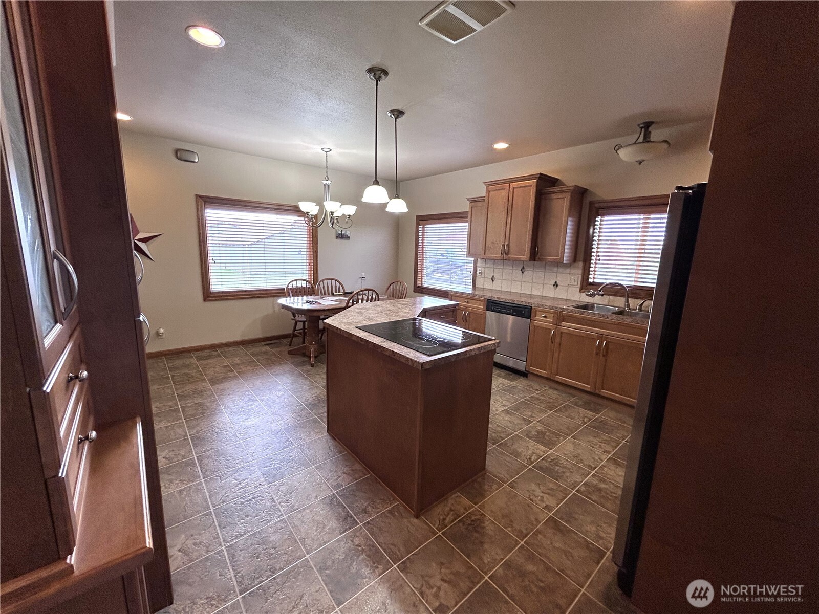 1925 Hampton Road Everson, WA 98247 - Photo 13 of 40 a kitchen with stainless steel appliances granite countertop a stove a sink dishwasher and a refrigerator