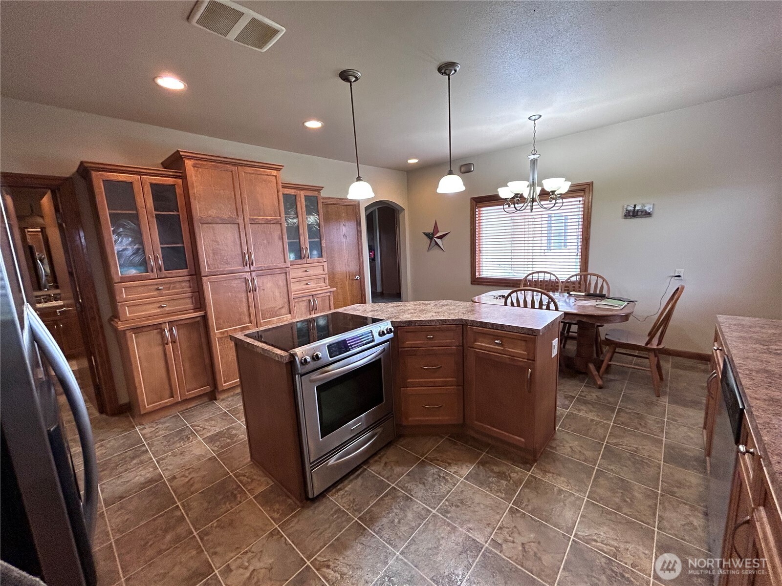 1925 Hampton Road Everson, WA 98247 - Photo 14 of 40 a kitchen with a stove a refrigerator and chairs
