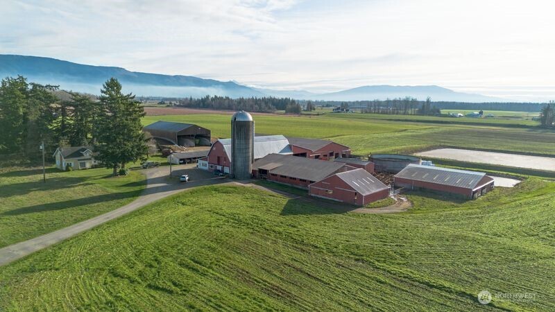 1925 Hampton Road Everson, WA 98247 - Photo 21 of 40 a view of a lake with a garden and houses