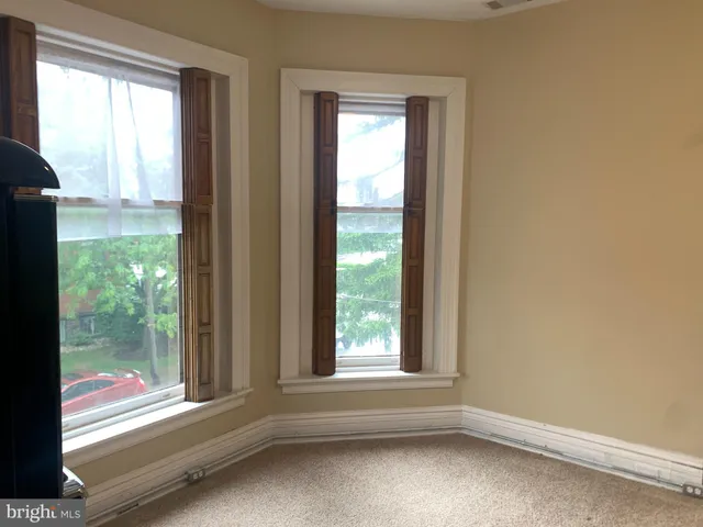 a view of a room that has a large window