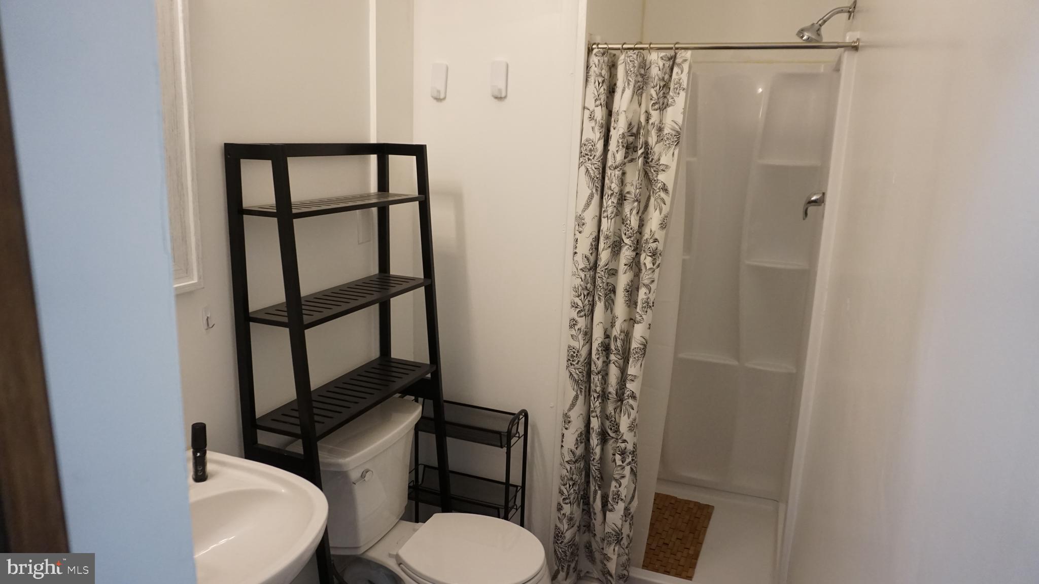 200 East Walnut Street, Unit 3 Hanover, PA 17331 - Photo 5 of 12 a bathroom with a toilet and a shower