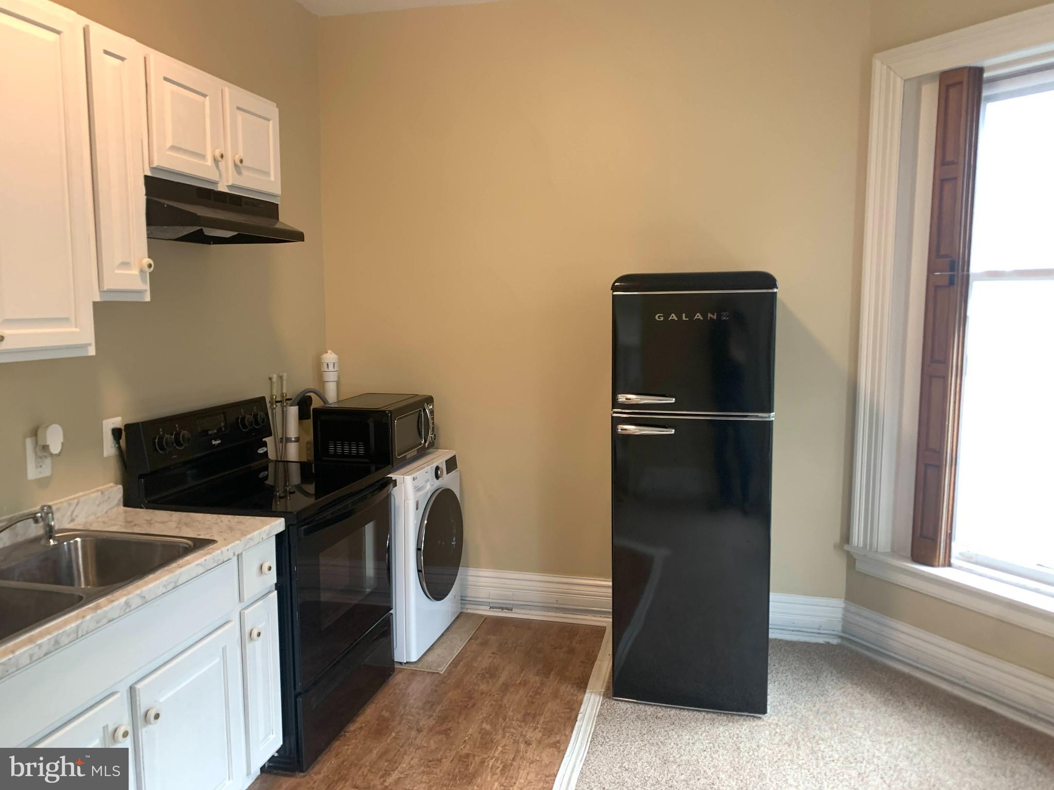 200 East Walnut Street, Unit 3 Hanover, PA 17331 - Photo 10 of 12 a kitchen with a refrigerator and a sink