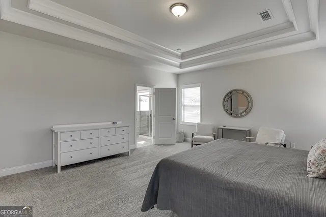 a bedroom with a bed and furniture