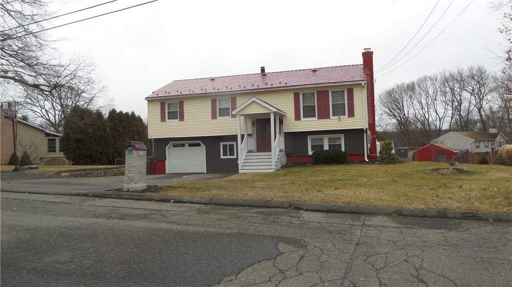 66 Autumn Ridge Road Naugatuck, CT 06770 - Photo 1 of 1 a front view of a house with a yard