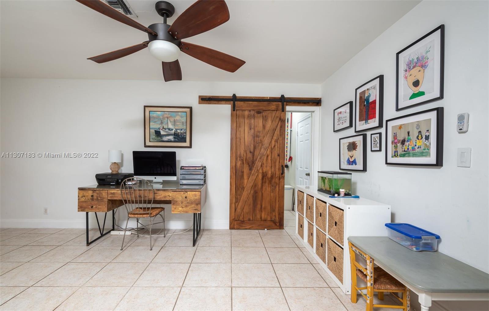 1592 Northwest 8th Street Boca Raton, FL 33486 - Photo 12 of 35 a room with furniture and a desk