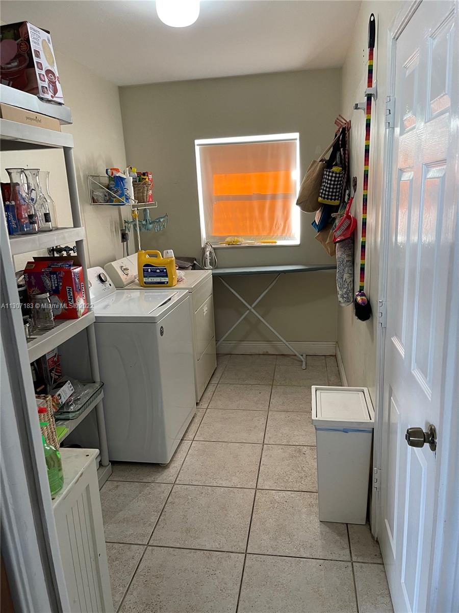 1592 Northwest 8th Street Boca Raton, FL 33486 - Photo 14 of 35 a room with storage and utility