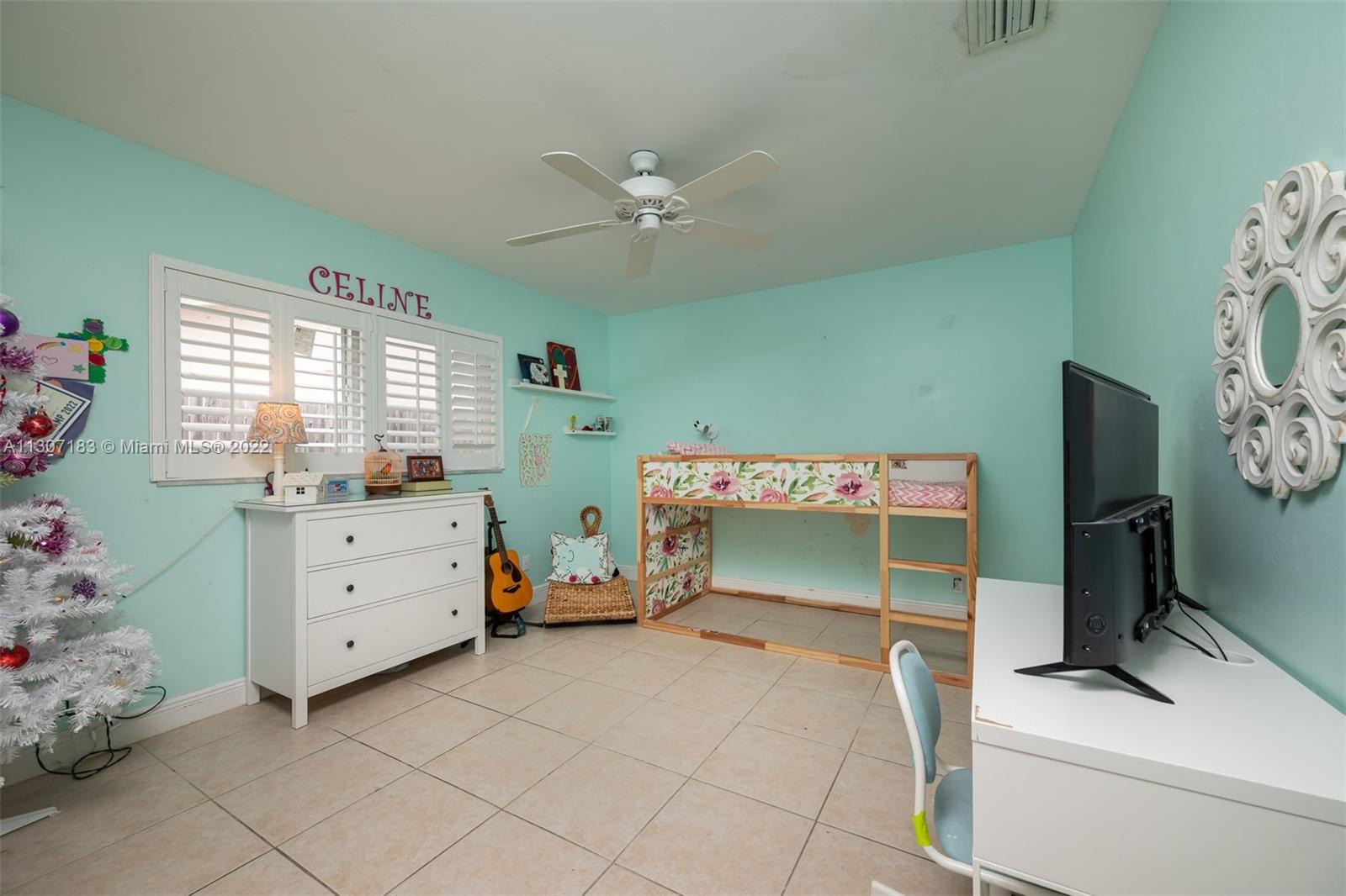 1592 Northwest 8th Street Boca Raton, FL 33486 - Photo 20 of 35 a bedroom with a bed and a window
