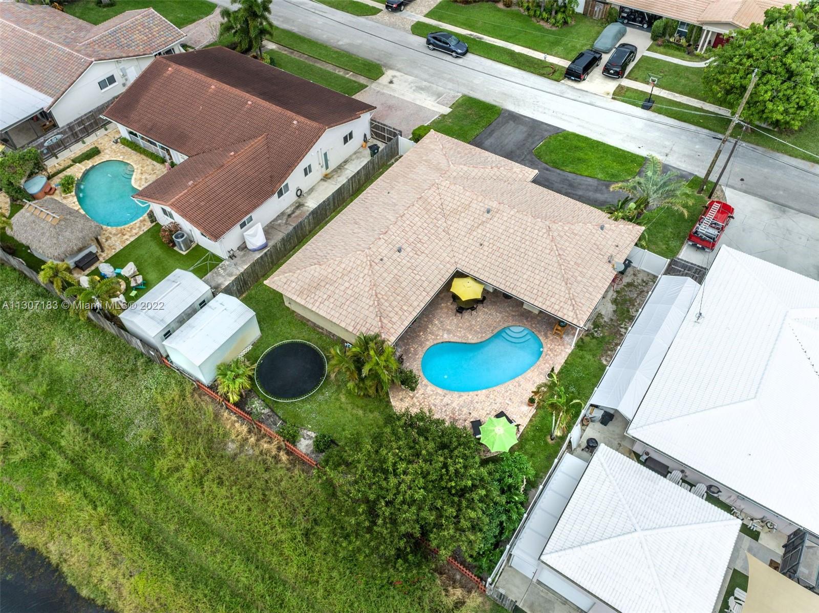 1592 Northwest 8th Street Boca Raton, FL 33486 - Photo 3 of 35 an aerial view of a house with outdoor space