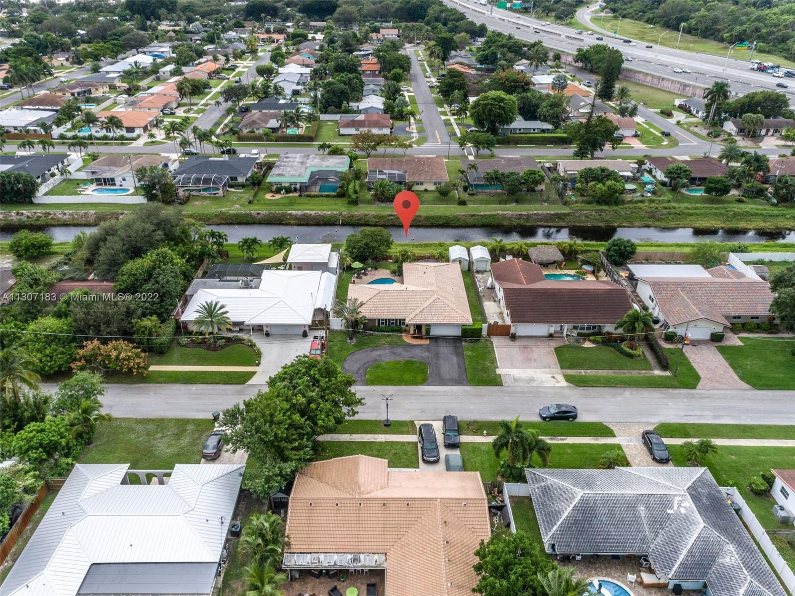 1592 Northwest 8th Street Boca Raton, FL 33486 - Photo 32 of 35 an aerial view of a houses and an outdoor space