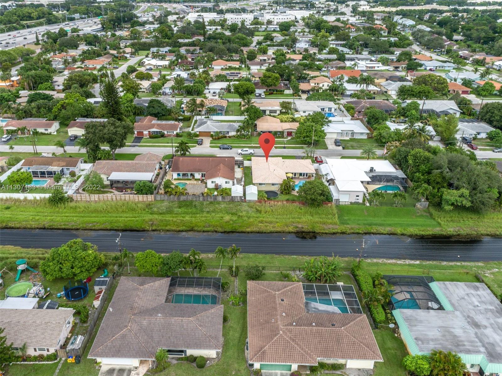 1592 Northwest 8th Street Boca Raton, FL 33486 - Photo 33 of 35 an aerial view of residential houses with outdoor space and parking