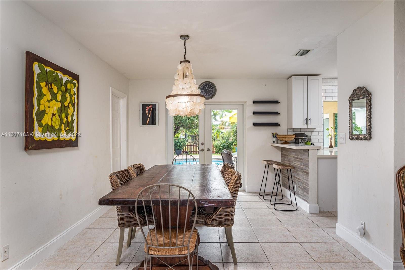 1592 Northwest 8th Street Boca Raton, FL 33486 - Photo 9 of 35 a view of a dining room with furniture window and outside view