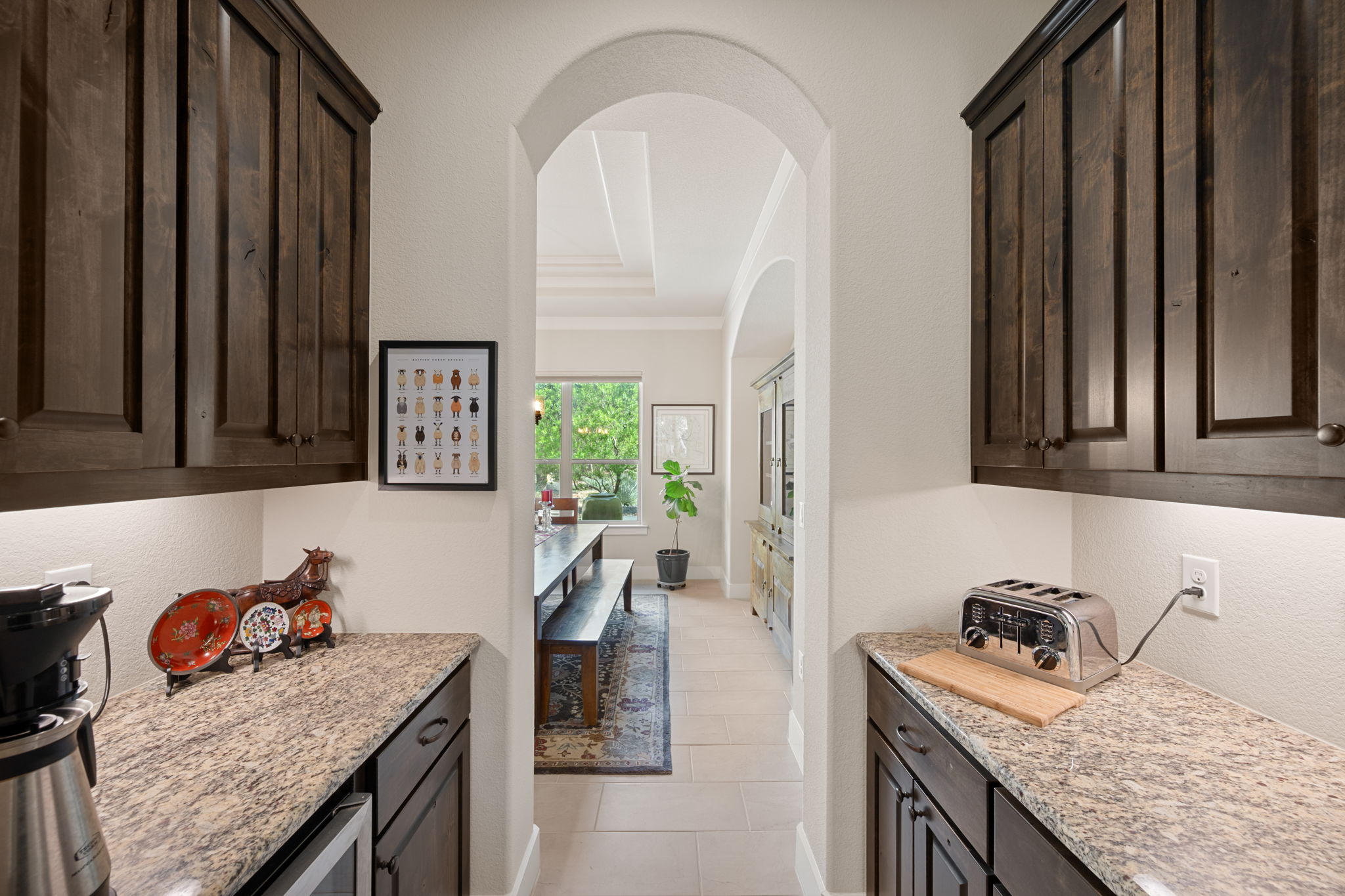 212 Marbella Way Georgetown, TX 78633 - Photo 16 of 40 a kitchen with a granite countertop sink stove and cabinets