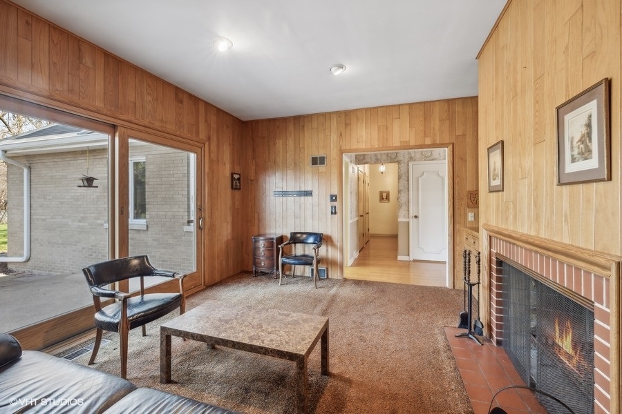 278 Longcommon Road Riverside, IL 60546 - Photo 14 of 36 a living room with furniture a dining table and chairs