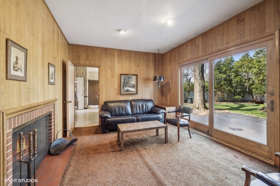 278 Longcommon Road Riverside, IL 60546 - Photo 15 of 36 a living room with furniture and a fireplace