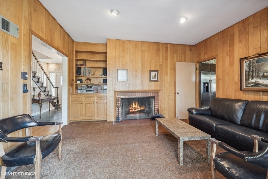 278 Longcommon Road Riverside, IL 60546 - Photo 16 of 36 a living room with furniture and a fireplace