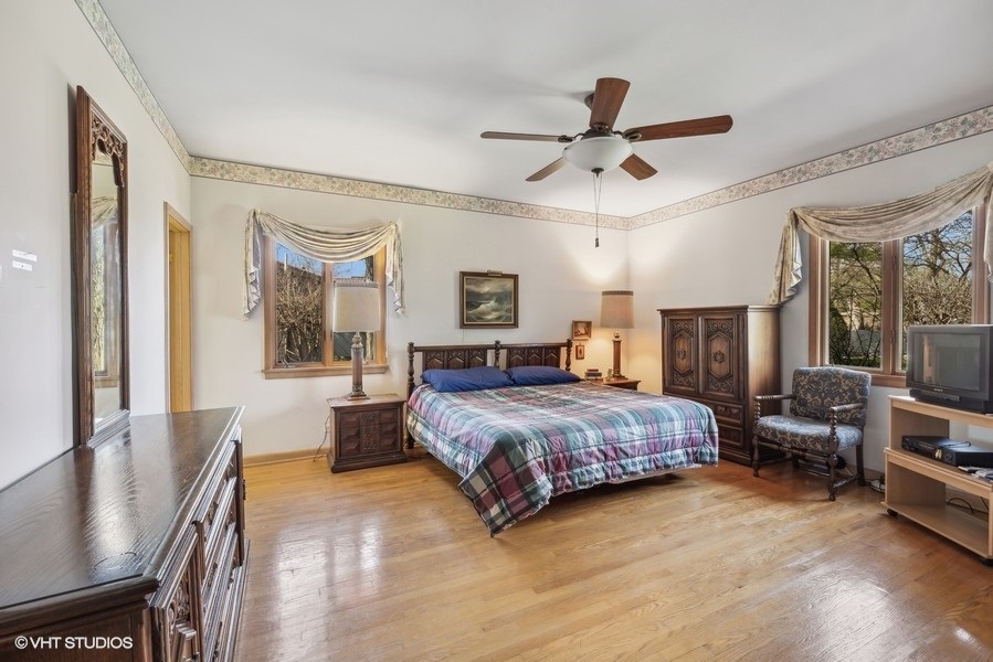 278 Longcommon Road Riverside, IL 60546 - Photo 18 of 36 a bedroom with a bed wooden floor and window