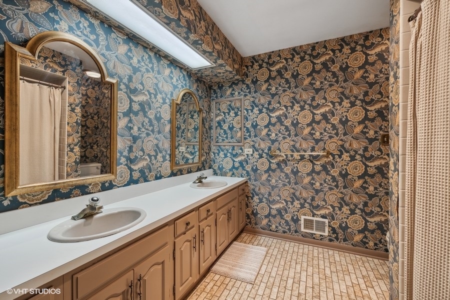278 Longcommon Road Riverside, IL 60546 - Photo 27 of 36 a bathroom with a sink and a mirror
