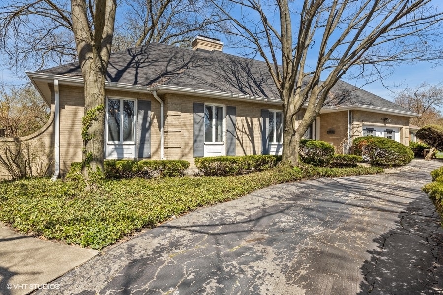 278 Longcommon Road Riverside, IL 60546 - Photo 3 of 36 front view of a house with a trees