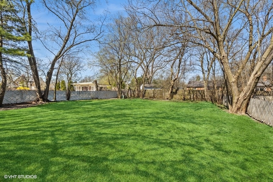 278 Longcommon Road Riverside, IL 60546 - Photo 31 of 36 a view of a backyard with large trees