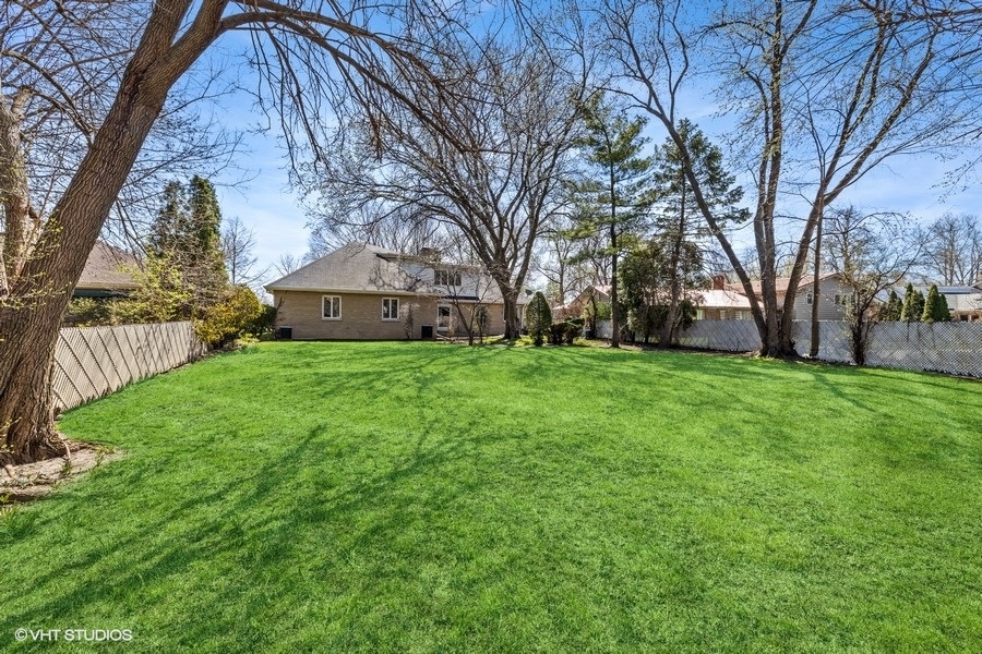278 Longcommon Road Riverside, IL 60546 - Photo 32 of 36 a view of a backyard with large trees