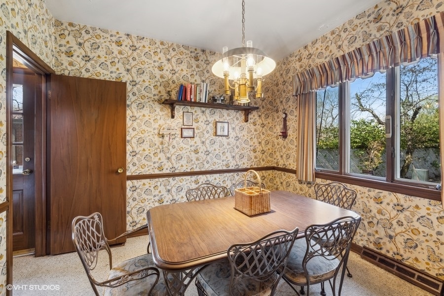 278 Longcommon Road Riverside, IL 60546 - Photo 8 of 36 a view of a dining room with furniture and chandelier