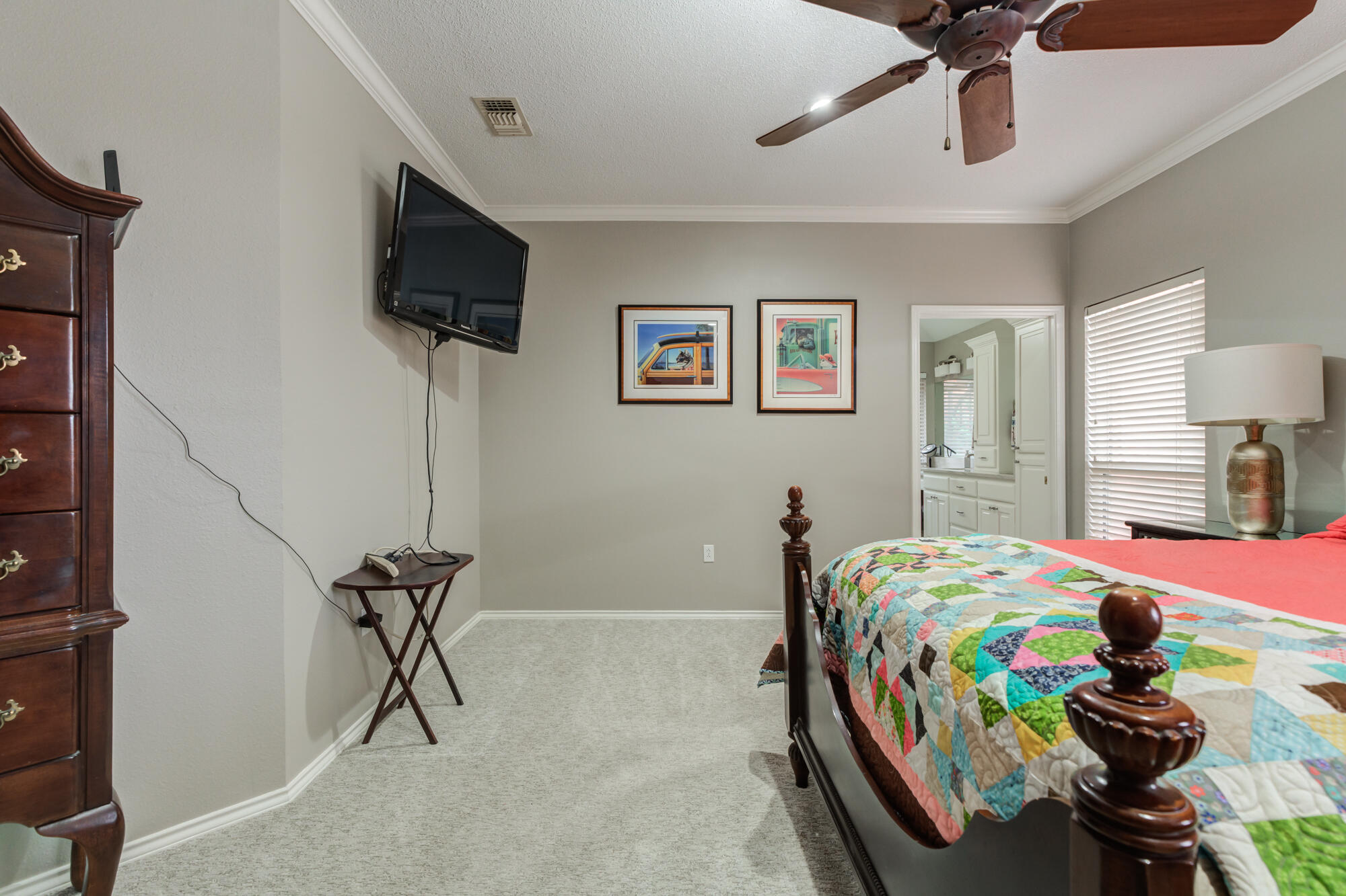 6908 Freeport Avenue Lubbock, TX 79424 - Photo 23 of 44 a bedroom with a bed and a flat screen tv