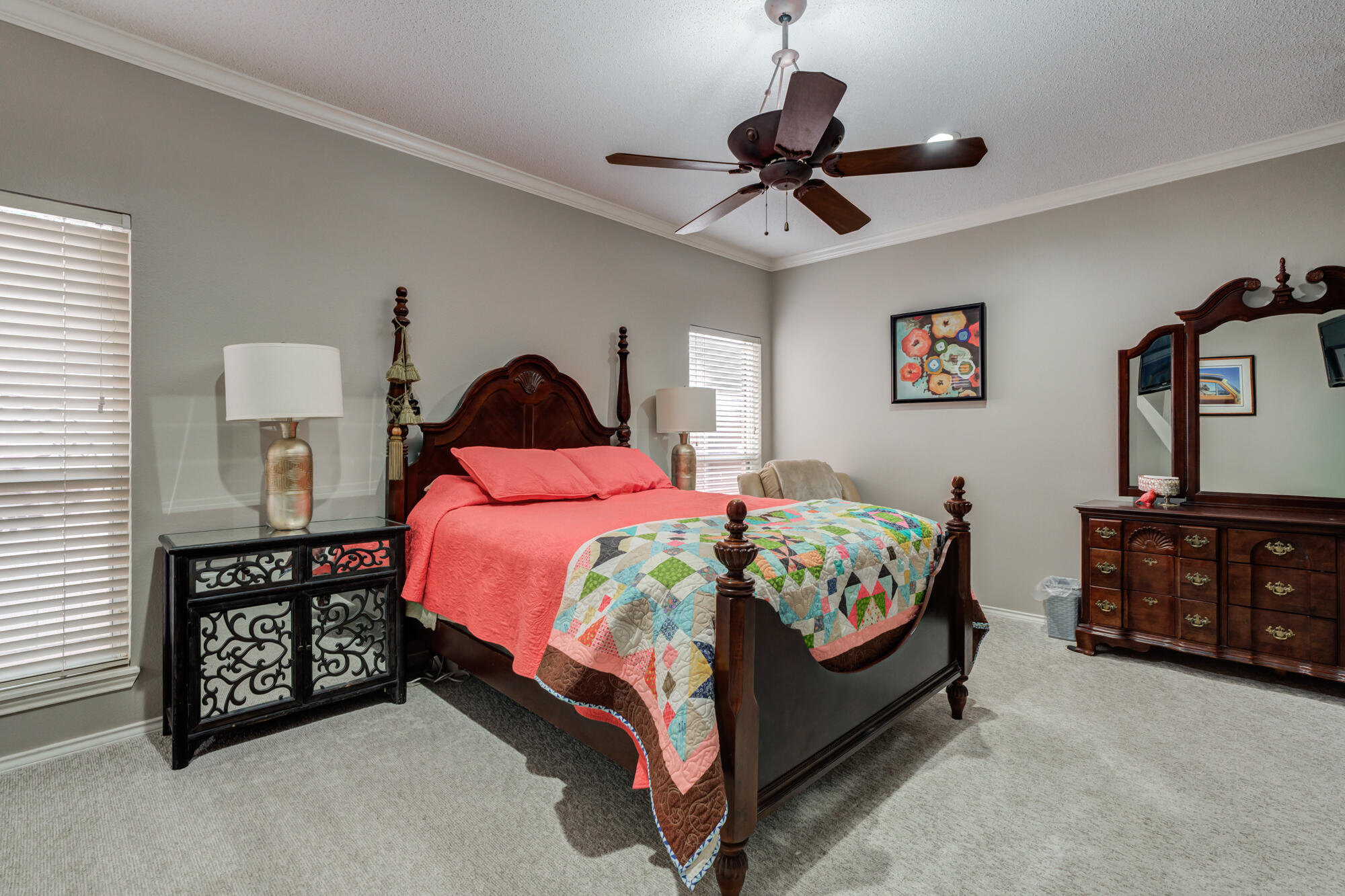 6908 Freeport Avenue Lubbock, TX 79424 - Photo 24 of 44 a bedroom with a bed and a chandelier