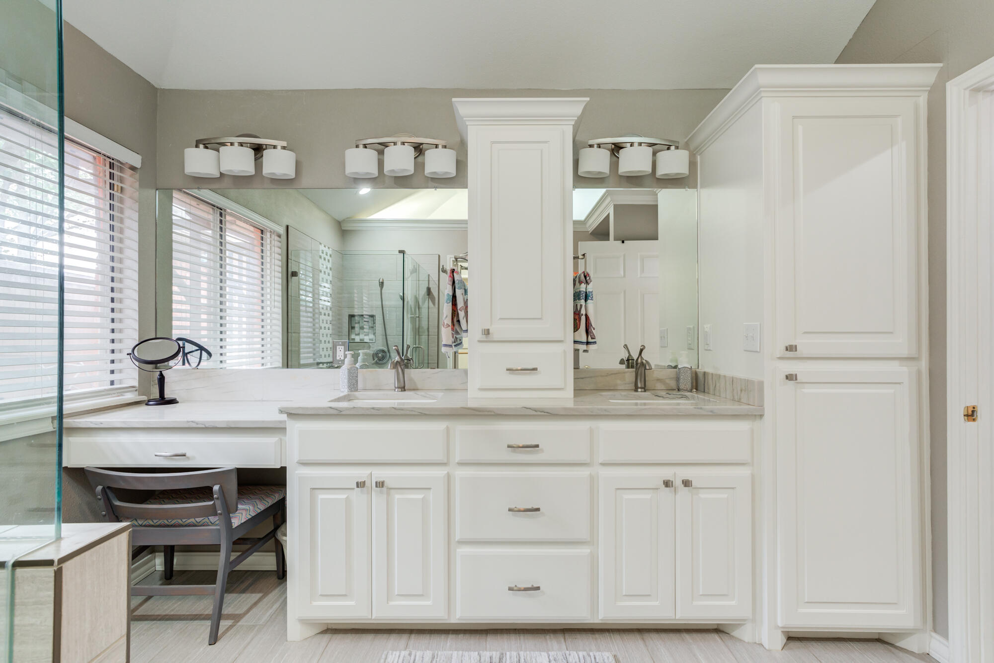 6908 Freeport Avenue Lubbock, TX 79424 - Photo 29 of 44 a bathroom with a double vanity sink and a mirror