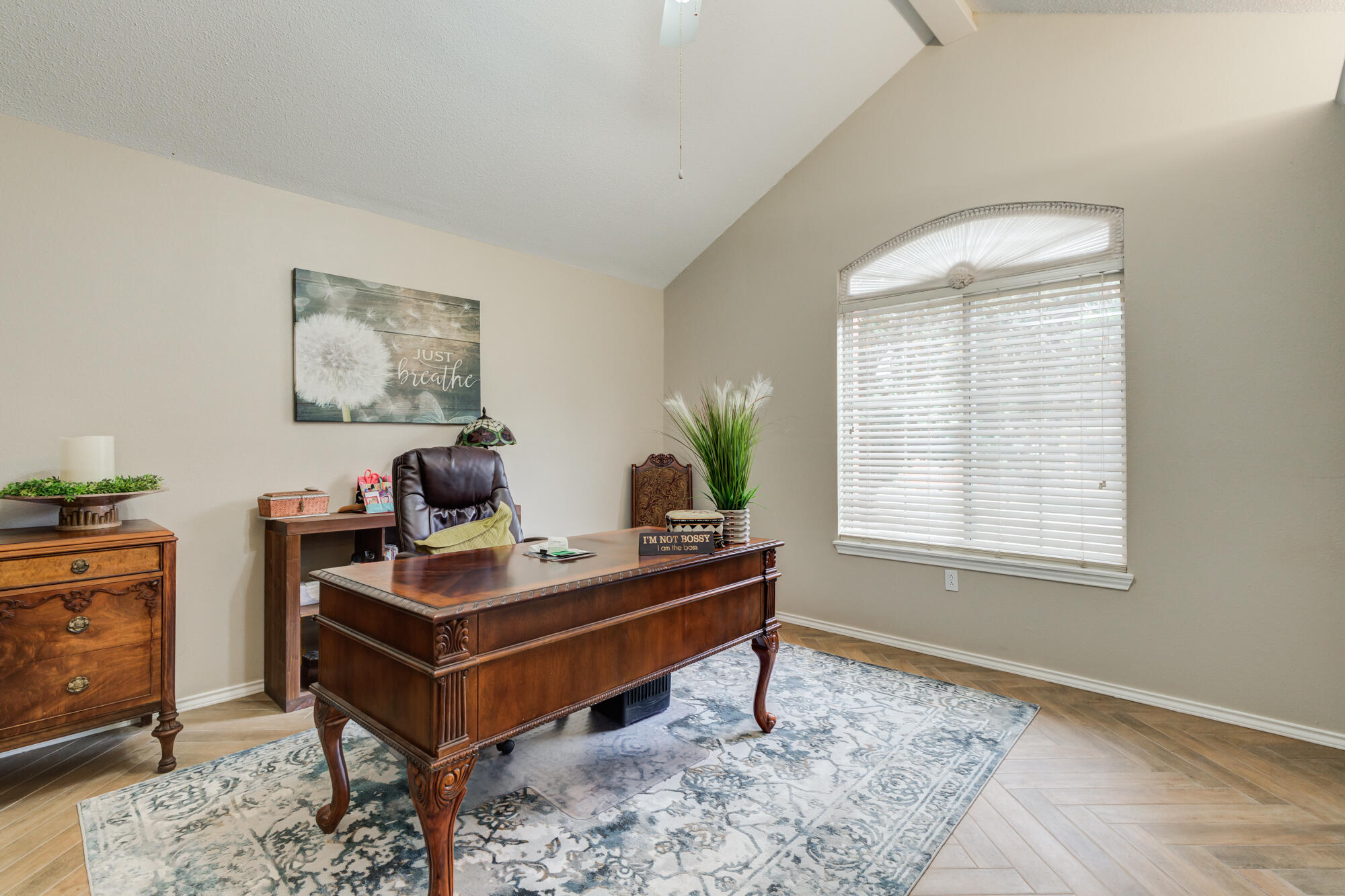 6908 Freeport Avenue Lubbock, TX 79424 - Photo 31 of 44 a view of a workspace with furniture and a window