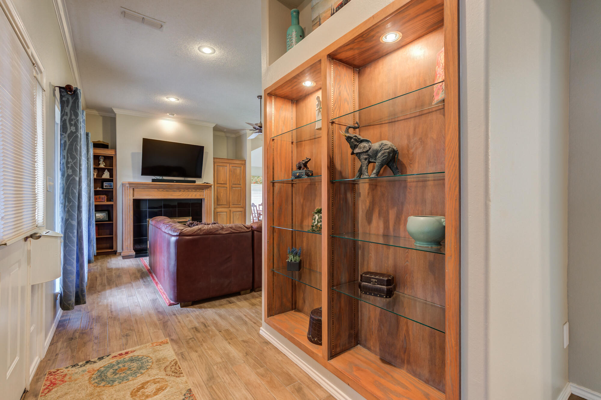 6908 Freeport Avenue Lubbock, TX 79424 - Photo 33 of 44 a view of a livingroom with furniture and a flat screen tv
