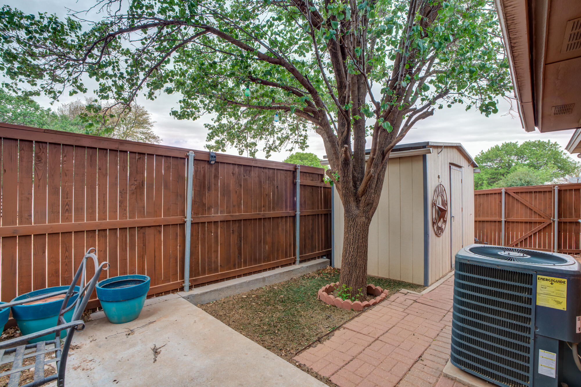 6908 Freeport Avenue Lubbock, TX 79424 - Photo 41 of 44 a backyard of a house with barbeque oven and outdoor seating