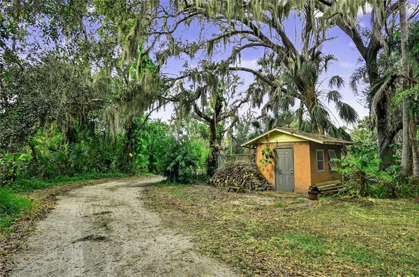 a view of a house with a tree