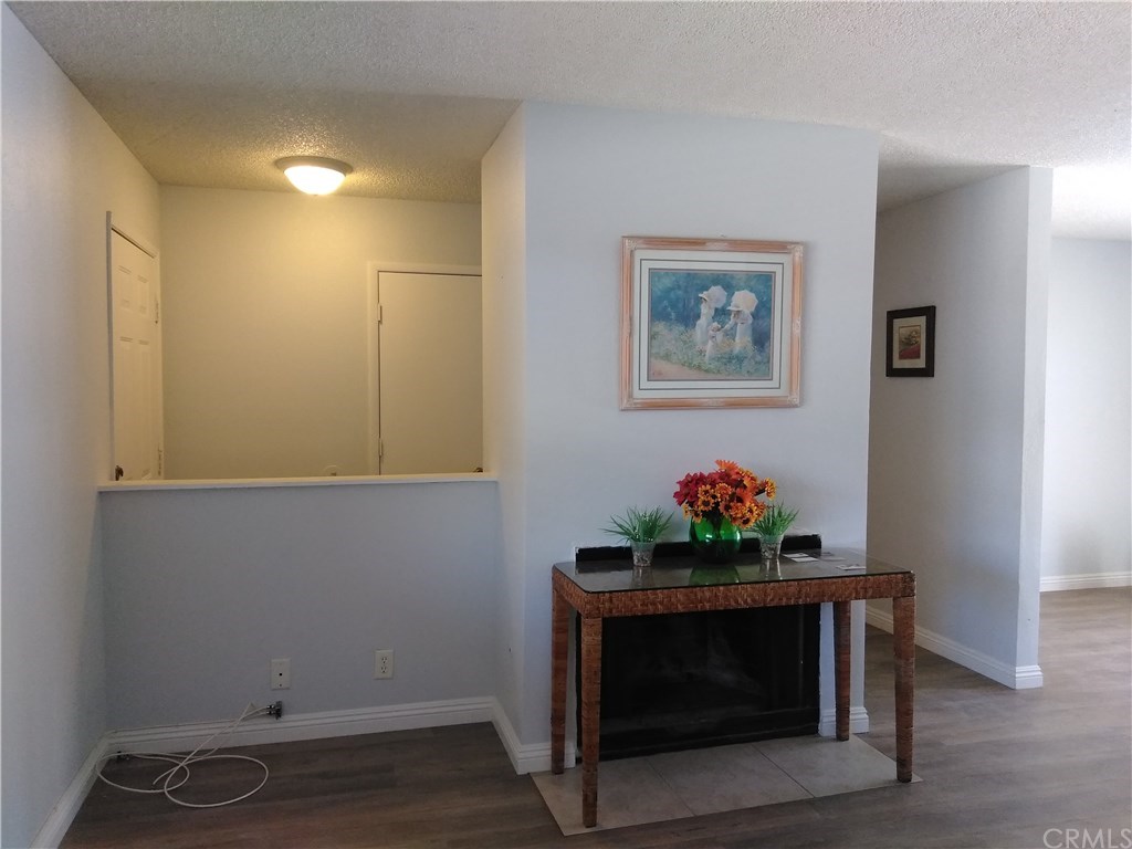 15965 Sago Road, Unit 14 Apple Valley, CA 92307 - Photo 1 of 1 a living room with furniture and a fireplace