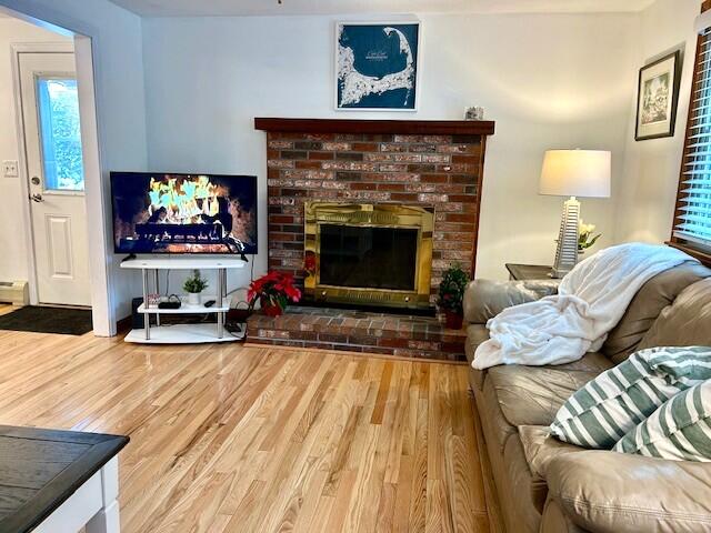 16 Bridgets Path Centerville, MA 02632 - Photo 13 of 29 a living room with furniture and a fireplace