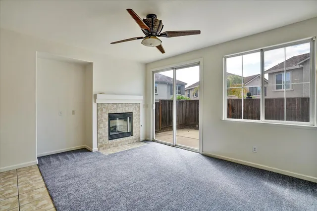 a view of a kitchen with a sink and refrigerator