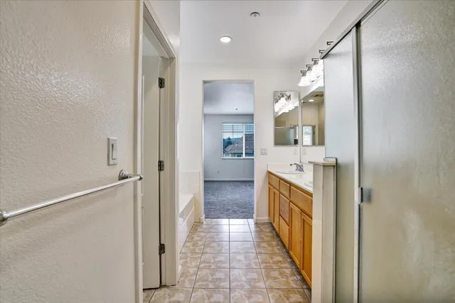 a view of a house with a wooden fence
