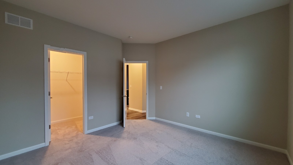 241 Timber Ridge Court Joliet, IL 60431 - Photo 12 of 14 an empty room with windows