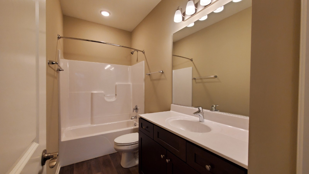 241 Timber Ridge Court Joliet, IL 60431 - Photo 13 of 14 a bathroom with a double vanity sink toilet mirror and bathtub