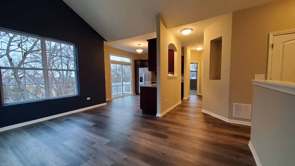 241 Timber Ridge Court Joliet, IL 60431 - Photo 5 of 14 a view of a big room with wooden floor and windows