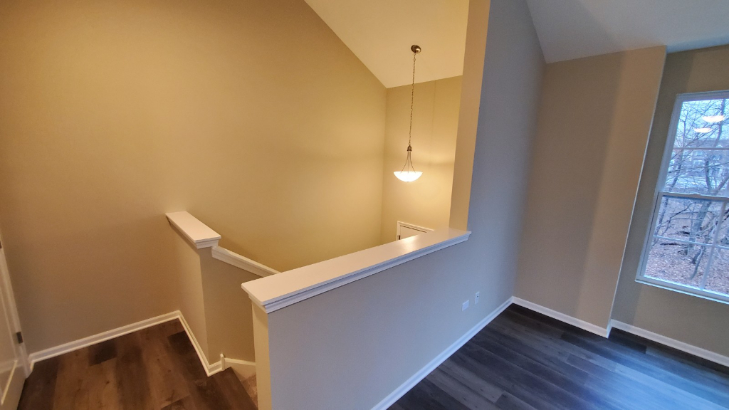 241 Timber Ridge Court Joliet, IL 60431 - Photo 6 of 14 a view of an empty room with wooden floor and a window