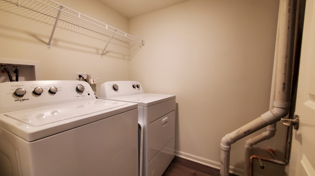 241 Timber Ridge Court Joliet, IL 60431 - Photo 8 of 14 a utility room with dryer and washer