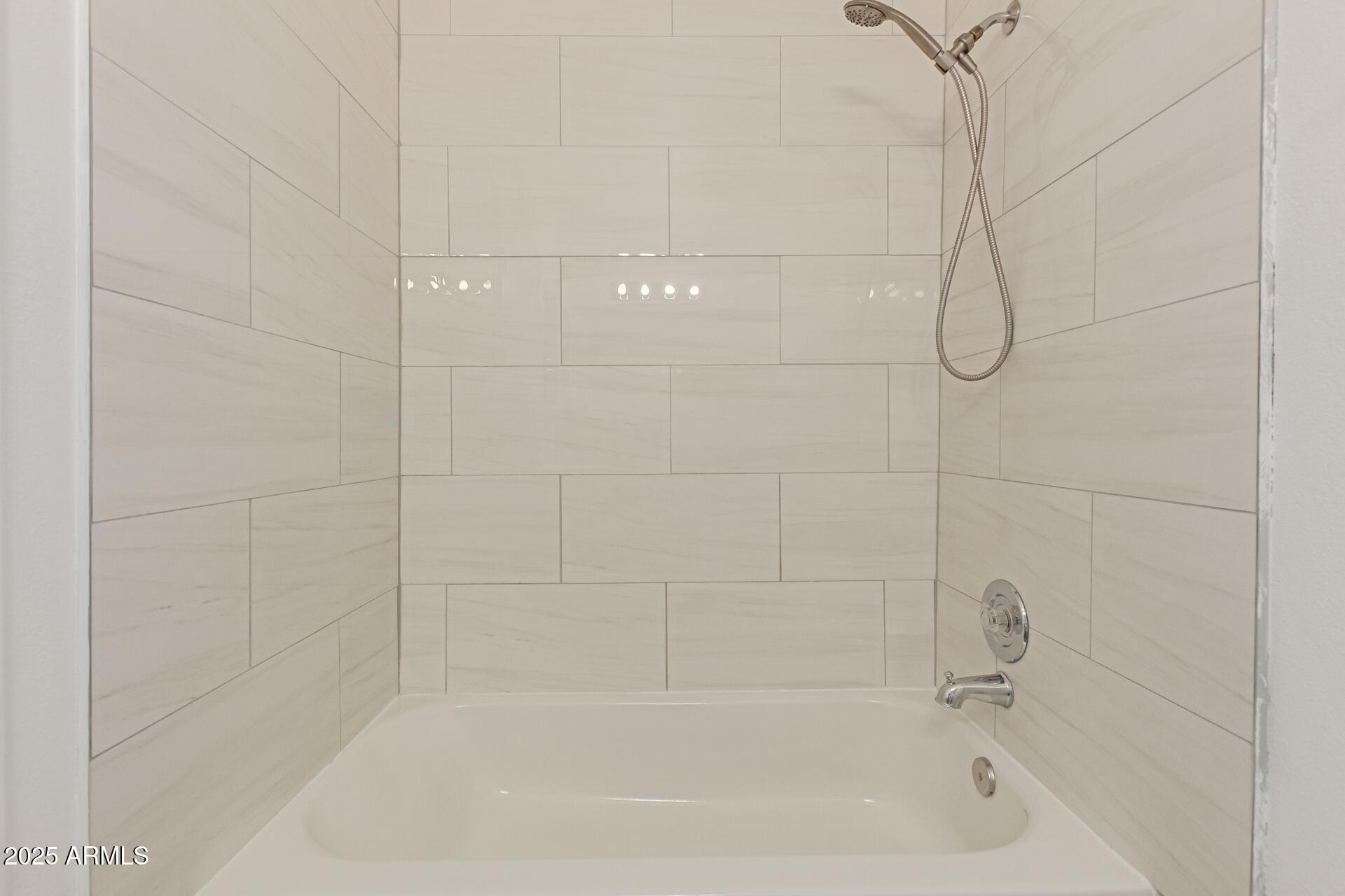 7977 West Wacker Road, Unit 244 Peoria, AZ 85381 - Photo 18 of 34 a close up of a bathtub in a bathroom