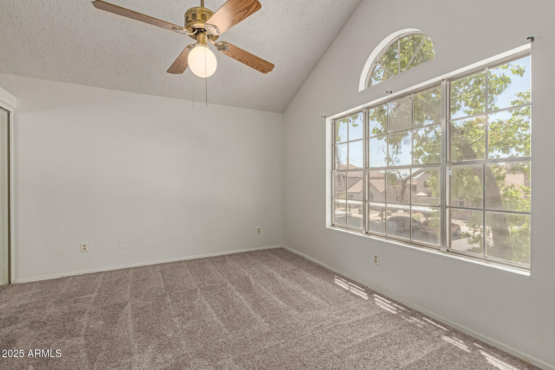 7977 West Wacker Road, Unit 244 Peoria, AZ 85381 - Photo 19 of 34 a view of an empty room with a window