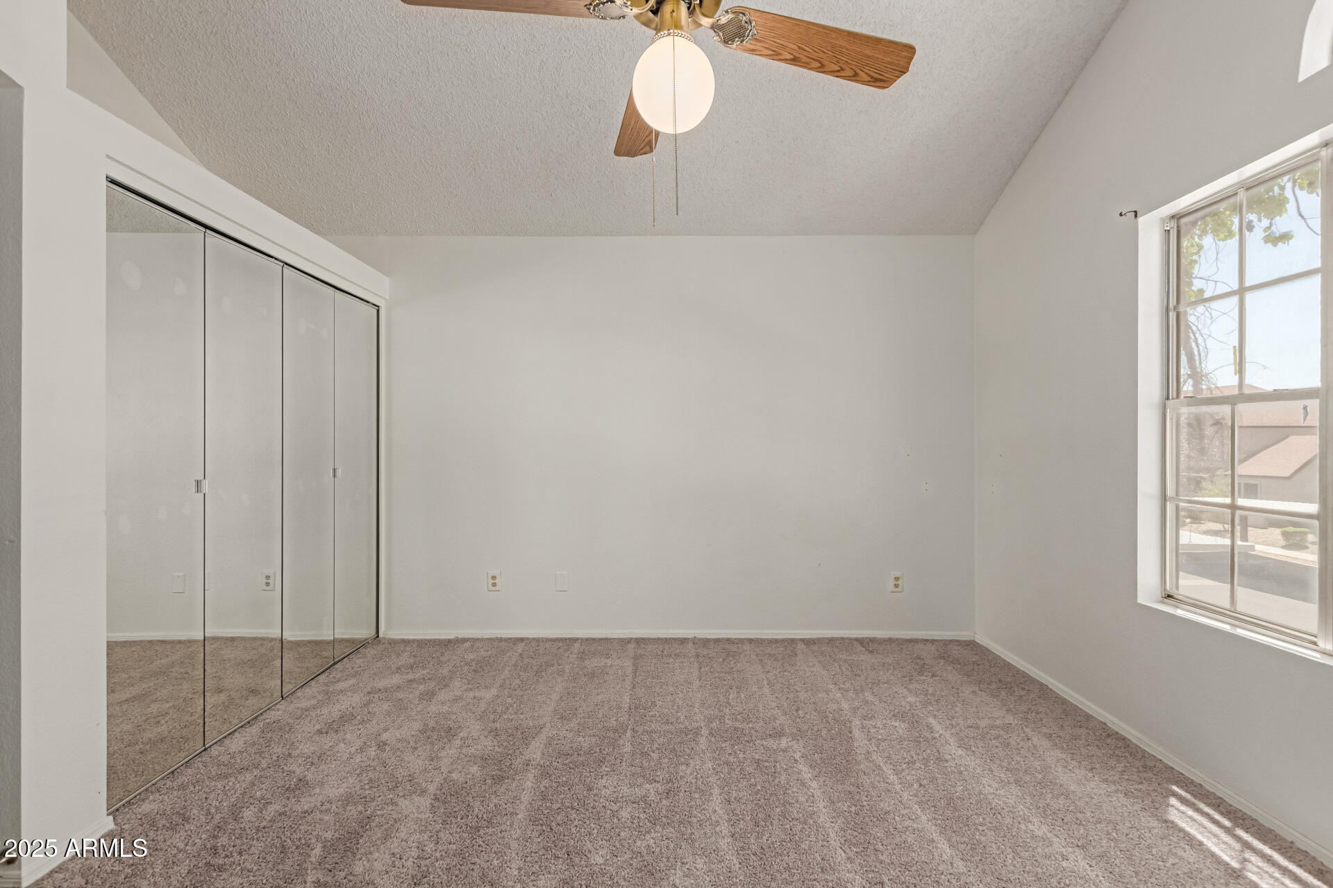 7977 West Wacker Road, Unit 244 Peoria, AZ 85381 - Photo 21 of 34 an empty room with windows and closet