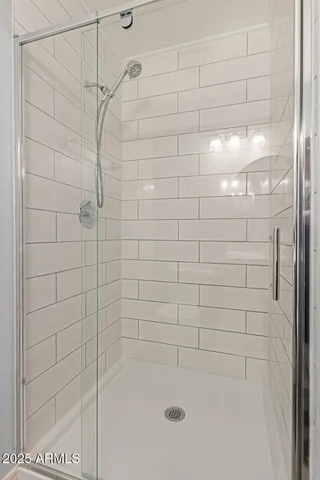 a bathroom with a sink mirror and toilet