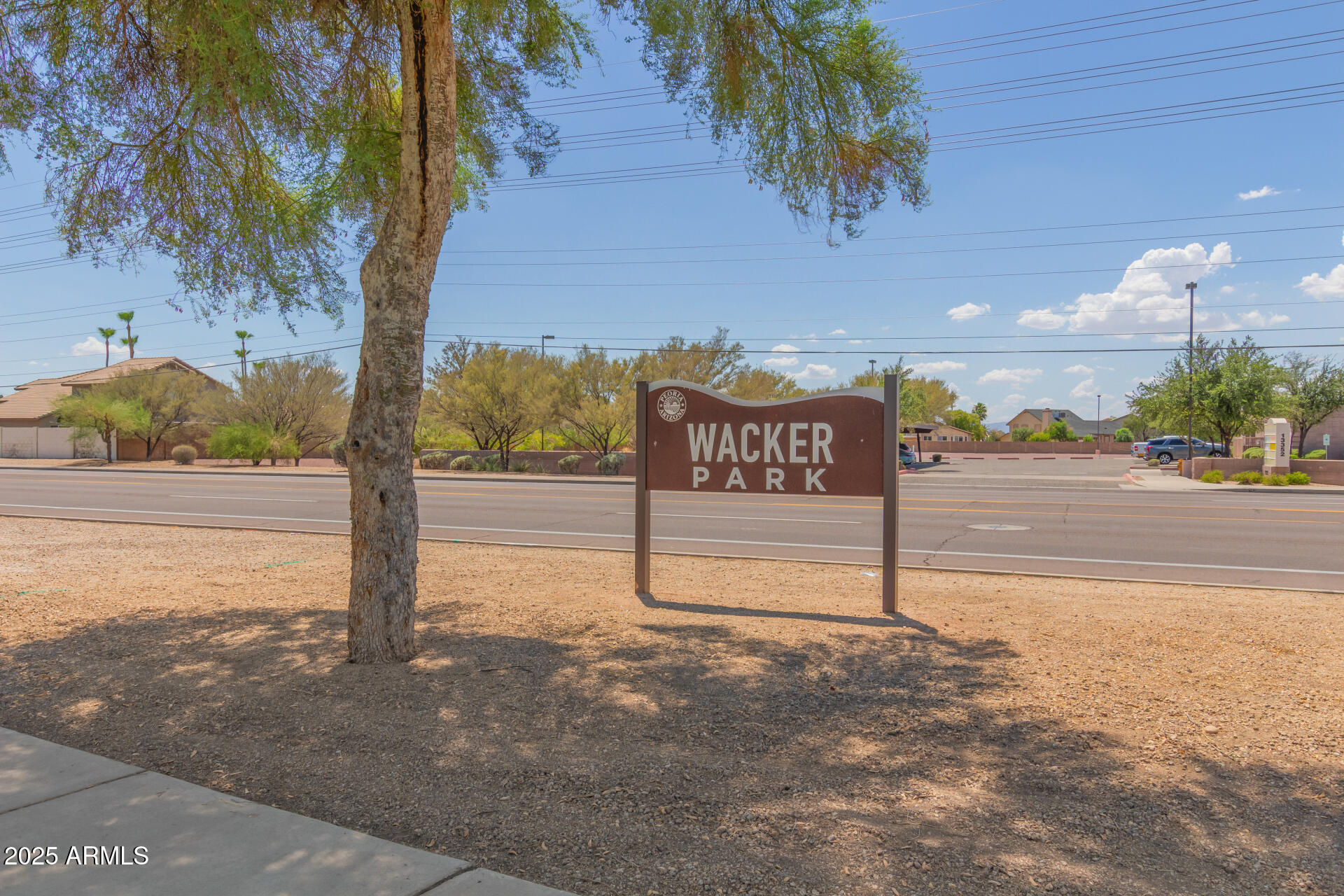 7977 West Wacker Road, Unit 244 Peoria, AZ 85381 - Photo 30 of 34 a view of a street with palm trees
