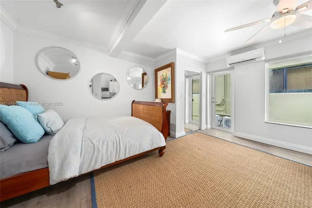 a bedroom with bed and window