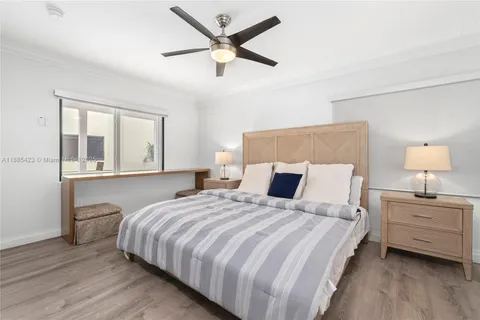 a bedroom with bed and window